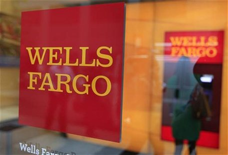 A Wells Fargo sign is seen outside a banking branch in New York July 13, 2012. REUTERS/Shannon Stapleton A Wells Fargo sign is seen outside a banking branch in New York July 13, 2012. REUTERS/Shannon Stapleton