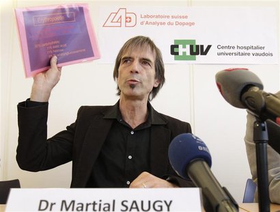 Director of the Swiss anti-doping laboratory Martial Saugy holds papers of a presentation during a news conference in Lausanne January 11, 2 Director of the Swiss anti-doping laboratory Martial Saugy holds papers of a presentation during a news conference in Lausanne January 11, 2