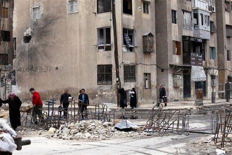 People cross the street to pass from non-liberated areas to areas controlled by the Free Syrian army in Aleppo January 8, 2013. Picture take People cross the street to pass from non-liberated areas to areas controlled by the Free Syrian army in Aleppo January 8, 2013. Picture take