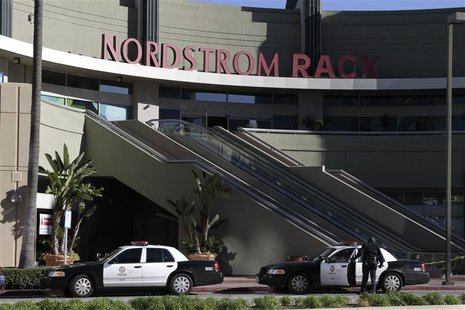 A Los Angeles Police Department officer stands near his vehicle outside the Nordstrom Rack store in the Westchester area of Los Angeles Janu A Los Angeles Police Department officer stands near his vehicle outside the Nordstrom Rack store in the Westchester area of Los Angeles Janu