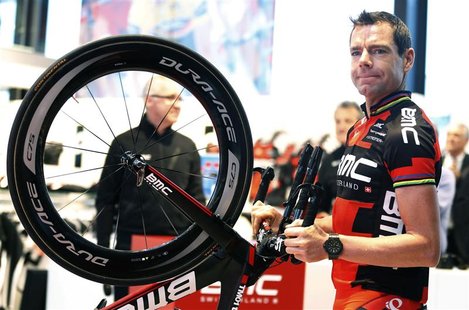BMC Racing Team rider Cadel Evans of Australia holds his bike as he arrives at the cycling team's official presentation in Nazareth, near Gh BMC Racing Team rider Cadel Evans of Australia holds his bike as he arrives at the cycling team's official presentation in Nazareth, near Gh