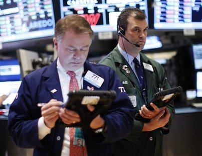 Traders work on the floor of the New York Stock Exchange, January 11, 2013. REUTERS/Brendan McDermid Traders work on the floor of the New York Stock Exchange, January 11, 2013. REUTERS/Brendan McDermid