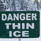 A thin ice warning sign. A thin ice warning sign.