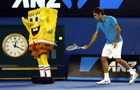 Roger Federer of Switzerland hits a ball into the back of a man dressed as the cartoon character Sponge Bob Square Pants during Kids Tennis Roger Federer of Switzerland hits a ball into the back of a man dressed as the cartoon character Sponge Bob Square Pants during Kids Tennis