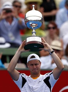 Australia's Lleyton Hewitt holds aloft the trophy after he defeated Argentina's Juan Martin Del Potro in the final at the Kooyong Classic te Australia's Lleyton Hewitt holds aloft the trophy after he defeated Argentina's Juan Martin Del Potro in the final at the Kooyong Classic te