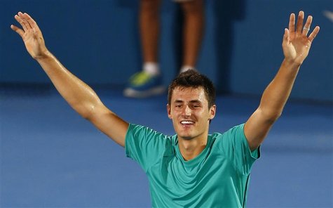 Bernard Tomic of Australia celebrates defeating Kevin Anderson of South Africa during their men's final match at the Sydney International te Bernard Tomic of Australia celebrates defeating Kevin Anderson of South Africa during their men's final match at the Sydney International te