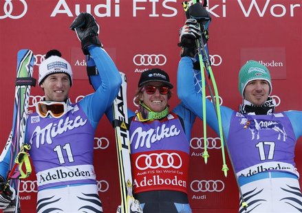 Ted Ligety of the U.S. (C) celebrates next to second-placed Fritz Dopfer of Germany (L) and third-placed Felix Neureuther of Germany on the Ted Ligety of the U.S. (C) celebrates next to second-placed Fritz Dopfer of Germany (L) and third-placed Felix Neureuther of Germany on the