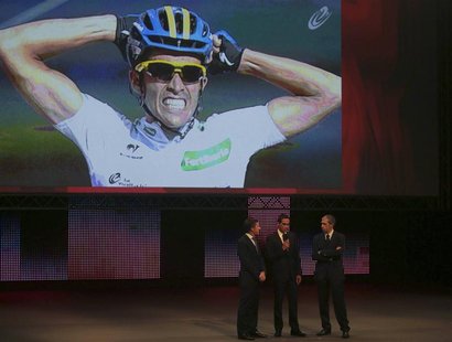 Team Saxo Bank rider and winner of the 2012 Tour of Spain, Alberto Contador (C) of Spain speaks during the 2013 Tour of Spain cycling race p Team Saxo Bank rider and winner of the 2012 Tour of Spain, Alberto Contador (C) of Spain speaks during the 2013 Tour of Spain cycling race p