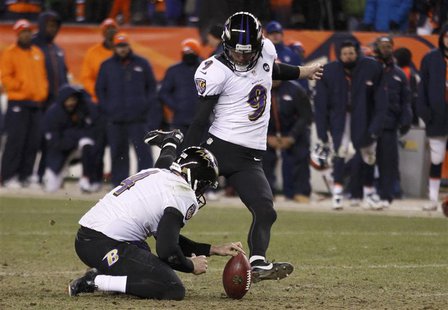 Baltimore Ravens kicker Justin Tucker (9) kicks the game winning field goal against the Denver Broncos with holder Sam Koch in their NFL AFC Baltimore Ravens kicker Justin Tucker (9) kicks the game winning field goal against the Denver Broncos with holder Sam Koch in their NFL AFC