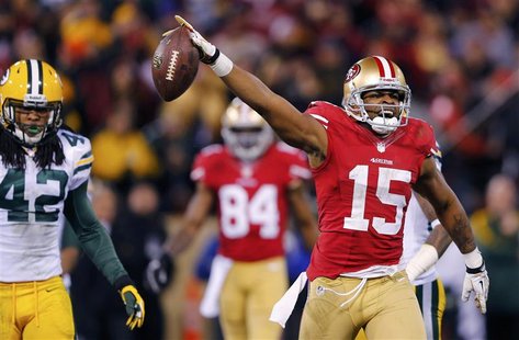 San Francisco 49ers Michael Crabtree (R) celebrate a pass reception next to Green Bay Packers Morgan Burnett (L) during the fourth quarter i San Francisco 49ers Michael Crabtree (R) celebrate a pass reception next to Green Bay Packers Morgan Burnett (L) during the fourth quarter i