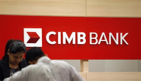 A staff attends to a customer at a branch of CIMB Bank in Kuala Lumpur December 8, 2009. REUTERS/Bazuki Muhammad A staff attends to a customer at a branch of CIMB Bank in Kuala Lumpur December 8, 2009. REUTERS/Bazuki Muhammad