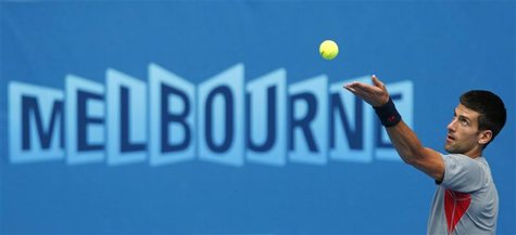 Novak Djokovic of Serbia serves during a practice session at the Australian Open tennis tournament in Melbourne January 13, 2013. REUTERS/Da Novak Djokovic of Serbia serves during a practice session at the Australian Open tennis tournament in Melbourne January 13, 2013. REUTERS/Da
