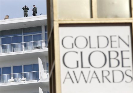 Security personnel watch from a rooftop ahead of the 70th annual Golden Globe Awards in Beverly Hills, California, January 13, 2013. REUTERS Security personnel watch from a rooftop ahead of the 70th annual Golden Globe Awards in Beverly Hills, California, January 13, 2013. REUTERS
