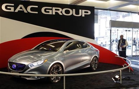 A man stops to look at GAC Motor's range-extended electric hybrid F-jet concept vehicle for display in Cobo Center in advance of media previ A man stops to look at GAC Motor's range-extended electric hybrid F-jet concept vehicle for display in Cobo Center in advance of media previ