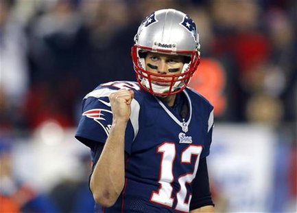 New England Patriots quarterback Tom Brady celebrates after the Patriots scored a touchdown in the third quarter of their NFL AFC Divisional New England Patriots quarterback Tom Brady celebrates after the Patriots scored a touchdown in the third quarter of their NFL AFC Divisional