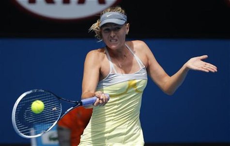 Maria Sharapova of Russia hits a return to compatriot Olga Puchkova during their women's singles match at the Australian Open tennis tournam Maria Sharapova of Russia hits a return to compatriot Olga Puchkova during their women's singles match at the Australian Open tennis tournam