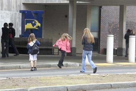 People arrive for a community meeting at the Newtown High school on the future of Sandy Hook Elementary School the site of the second-deadli People arrive for a community meeting at the Newtown High school on the future of Sandy Hook Elementary School the site of the second-deadli