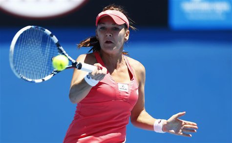 Agnieszka Radwanska of Poland hits a return to Bojana Bobusic of Australia during their women's singles match at the Australian Open tennis Agnieszka Radwanska of Poland hits a return to Bojana Bobusic of Australia during their women's singles match at the Australian Open tennis
