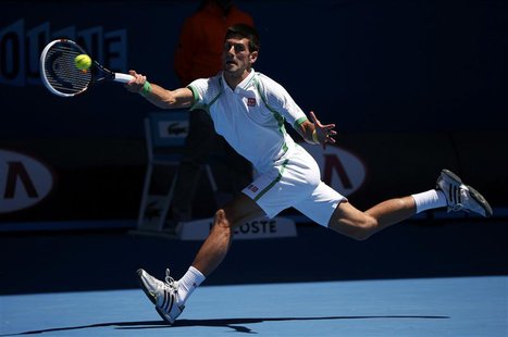 Novak Djokovic of Serbia hits a return to Paul-Henri Mathieu of France during their men's singles match at the Australian Open tennis tourna Novak Djokovic of Serbia hits a return to Paul-Henri Mathieu of France during their men's singles match at the Australian Open tennis tourna