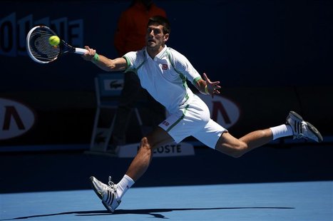 Novak Djokovic of Serbia hits a return to Paul-Henri Mathieu of France during their men's singles match at the Australian Open tennis tourna Novak Djokovic of Serbia hits a return to Paul-Henri Mathieu of France during their men's singles match at the Australian Open tennis tourna