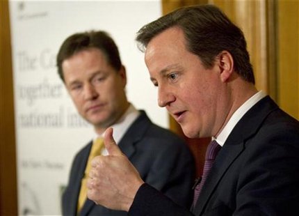 Britain's Prime Minister, David Cameron (R), accompanied by Deputy Prime Minister, Nick Clegg, speaks at a news conference in 10 Downing Str Britain's Prime Minister, David Cameron (R), accompanied by Deputy Prime Minister, Nick Clegg, speaks at a news conference in 10 Downing Str