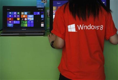 An attendant checks a computer during the launch of Microsoft Windows 8 operating system in Hong Kong October 26, 2012. REUTERS/Bobby Yip An attendant checks a computer during the launch of Microsoft Windows 8 operating system in Hong Kong October 26, 2012. REUTERS/Bobby Yip