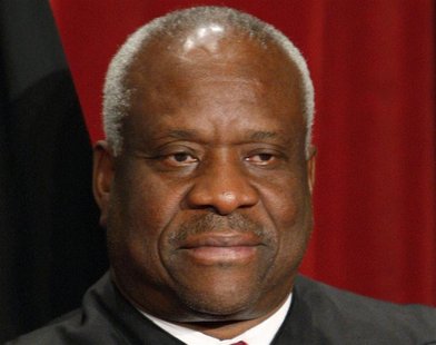 U.S. Supreme Court Justice Clarence Thomas poses for an official photograph with the other Justices at the Supreme Court in Washington, in t U.S. Supreme Court Justice Clarence Thomas poses for an official photograph with the other Justices at the Supreme Court in Washington, in t