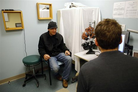 Mark Perrault (L) and registered nurse Sam Clark talk during Perrault's weekly nurse visit as part of his treatment regimen for opiate depen Mark Perrault (L) and registered nurse Sam Clark talk during Perrault's weekly nurse visit as part of his treatment regimen for opiate depen