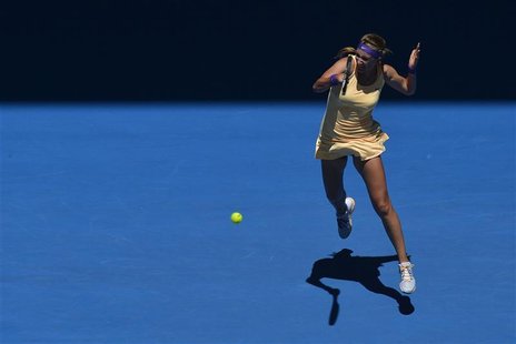 Victoria Azarenka of Belarus hits a return to Monica Niculescu of Romania during their women's singles match at the Australian Open tennis t Victoria Azarenka of Belarus hits a return to Monica Niculescu of Romania during their women's singles match at the Australian Open tennis t