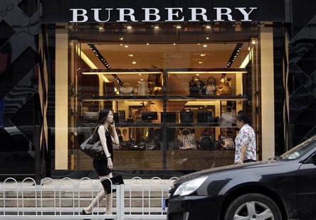 Women walk past a Burberry shop in Beijing, July 11, 2012. REUTERS/Jason Lee Women walk past a Burberry shop in Beijing, July 11, 2012. REUTERS/Jason Lee