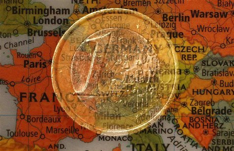 A picture illustration taken with the multiple exposure function of the camera shows a one Euro coin and a map of Europe, January 9, 2013. R A picture illustration taken with the multiple exposure function of the camera shows a one Euro coin and a map of Europe, January 9, 2013. R