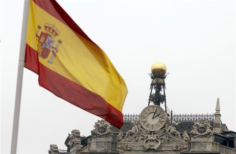 A Spanish flag flutters near the dome of the Bank of Spain in central Madrid February 15, 2010. REUTERS/Sergio Perez A Spanish flag flutters near the dome of the Bank of Spain in central Madrid February 15, 2010. REUTERS/Sergio Perez