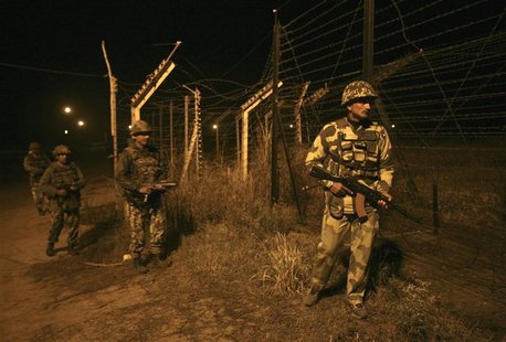 Indian Border Security Force (BSF) soldiers walk during night patrol near the fenced border with Pakistan in Abdullian, southwest of Jammu J Indian Border Security Force (BSF) soldiers walk during night patrol near the fenced border with Pakistan in Abdullian, southwest of Jammu J