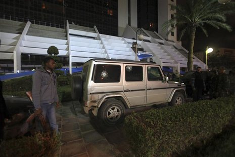 Security officers stand near the Italian consul's car after it was shot by unknown assailants in Benghazi January 12, 2013. REUTERS/Esam Al- Security officers stand near the Italian consul's car after it was shot by unknown assailants in Benghazi January 12, 2013. REUTERS/Esam Al-