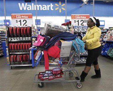 Tasha heads to checkout at a Walmart Store in Chicago, November 23, 2012. REUTERS/John Gress Tasha heads to checkout at a Walmart Store in Chicago, November 23, 2012. REUTERS/John Gress