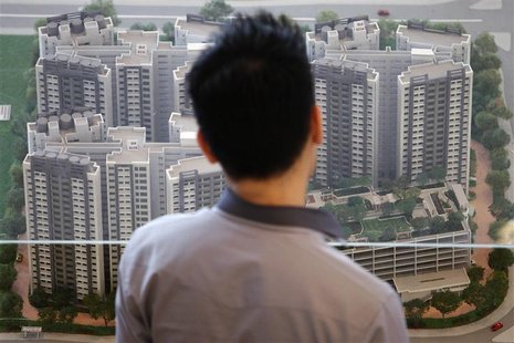 A man looks at a model of a new public housing estate to be launched at the Housing Development Board (HDB) gallery in Singapore January 15, A man looks at a model of a new public housing estate to be launched at the Housing Development Board (HDB) gallery in Singapore January 15,
