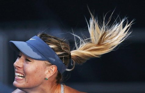 Maria Sharapova of Russia serves to Misaki Doi of Japan during their women's singles match at the Australian Open tennis tournament in Melbo Maria Sharapova of Russia serves to Misaki Doi of Japan during their women's singles match at the Australian Open tennis tournament in Melbo