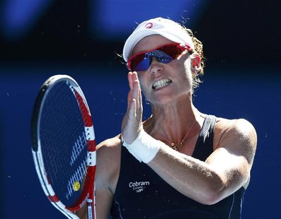 Samantha Stosur of Australia reacts during her women's singles match against Zheng Jie of China at the Australian Open tennis tournament in Samantha Stosur of Australia reacts during her women's singles match against Zheng Jie of China at the Australian Open tennis tournament in