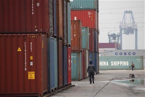 A man walks in a shipping container area at the Port of Shanghai April 10, 2012. REUTERS/Aly Song A man walks in a shipping container area at the Port of Shanghai April 10, 2012. REUTERS/Aly Song