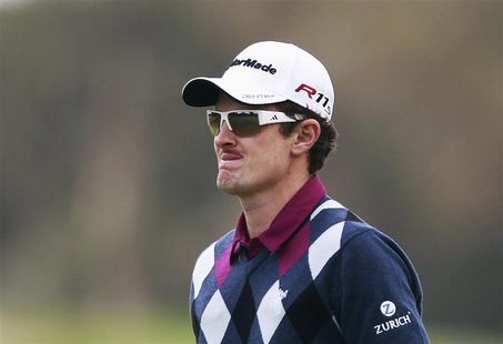 Justin Rose of England reacts after missing a putt at the third green during the final round of the Australian Open golf tournament in Sydne Justin Rose of England reacts after missing a putt at the third green during the final round of the Australian Open golf tournament in Sydne