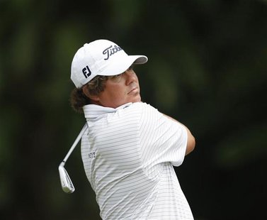 Jason Dufner of the U.S. watches his shot on the first hole during the Malaysia's Asia Pacific Classic golf tournament in Kuala Lumpur Octob Jason Dufner of the U.S. watches his shot on the first hole during the Malaysia's Asia Pacific Classic golf tournament in Kuala Lumpur Octob