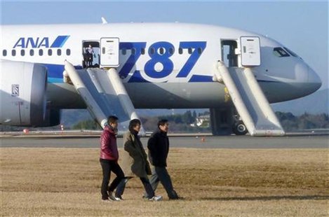 Passengers walk away from All Nippon Airways' (ANA) Boeing Co's 787 Dreamliner plane which made an emergency landing at Takamatsu airport, w Passengers walk away from All Nippon Airways' (ANA) Boeing Co's 787 Dreamliner plane which made an emergency landing at Takamatsu airport, w