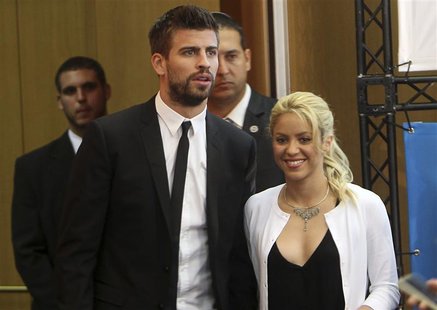 Colombian pop star and the United Nations Children's Fund (UNICEF) ambassador, Shakira, walks with her boyfriend, Barcelona soccer player Ge Colombian pop star and the United Nations Children's Fund (UNICEF) ambassador, Shakira, walks with her boyfriend, Barcelona soccer player Ge