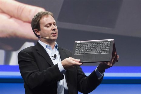 Kirk Skaugen, Intel's vice president of PC client group, converts a Lenovo Yoga Ultrabook into a tablet, at an Intel news conference during Kirk Skaugen, Intel's vice president of PC client group, converts a Lenovo Yoga Ultrabook into a tablet, at an Intel news conference during