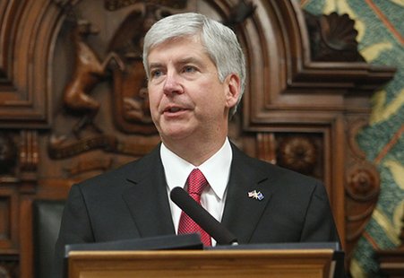 Governor Snyder at the rostrum before a joint session of the legislature. Governor Snyder at the rostrum before a joint session of the legislature.