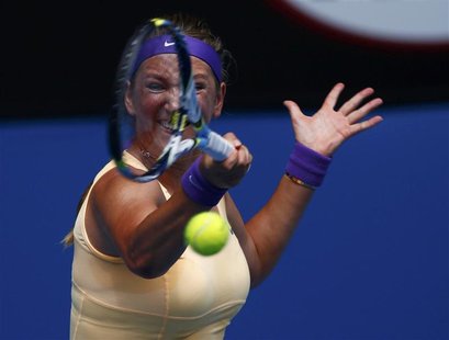 Victoria Azarenka of Belarus hits a return to Eleni Daniilidou of Greece during their women's singles match at the Australian Open tennis to Victoria Azarenka of Belarus hits a return to Eleni Daniilidou of Greece during their women's singles match at the Australian Open tennis to