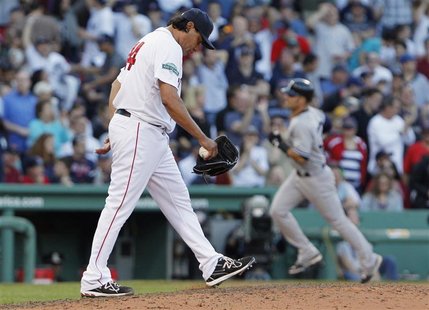 Boston Red Sox pitcher Vicente Padilla (L) reacts as New York Yankees' Nick Swisher (R) rounds the bases after hitting a grand slam during t Boston Red Sox pitcher Vicente Padilla (L) reacts as New York Yankees' Nick Swisher (R) rounds the bases after hitting a grand slam during t