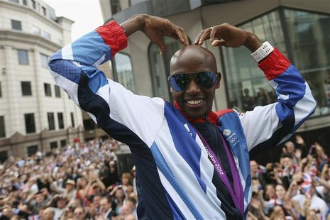 Long distance runner Mo Farah makes his trademark "Mobot" pose during a parade of British Olympic and Paralympic athletes through London Sep Long distance runner Mo Farah makes his trademark "Mobot" pose during a parade of British Olympic and Paralympic athletes through London Sep