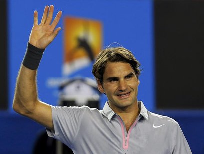 Roger Federer of Switzerland celebrates defeating Nikolay Davydenko of Russia in their men's singles match at the Australian Open tennis tou Roger Federer of Switzerland celebrates defeating Nikolay Davydenko of Russia in their men's singles match at the Australian Open tennis tou
