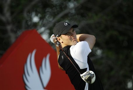 Martin Kaymer of Germany tees off on the 13th hole during the first round of the Abu Dhabi Golf Championship at the Abu Dhabi Golf Club Janu Martin Kaymer of Germany tees off on the 13th hole during the first round of the Abu Dhabi Golf Championship at the Abu Dhabi Golf Club Janu